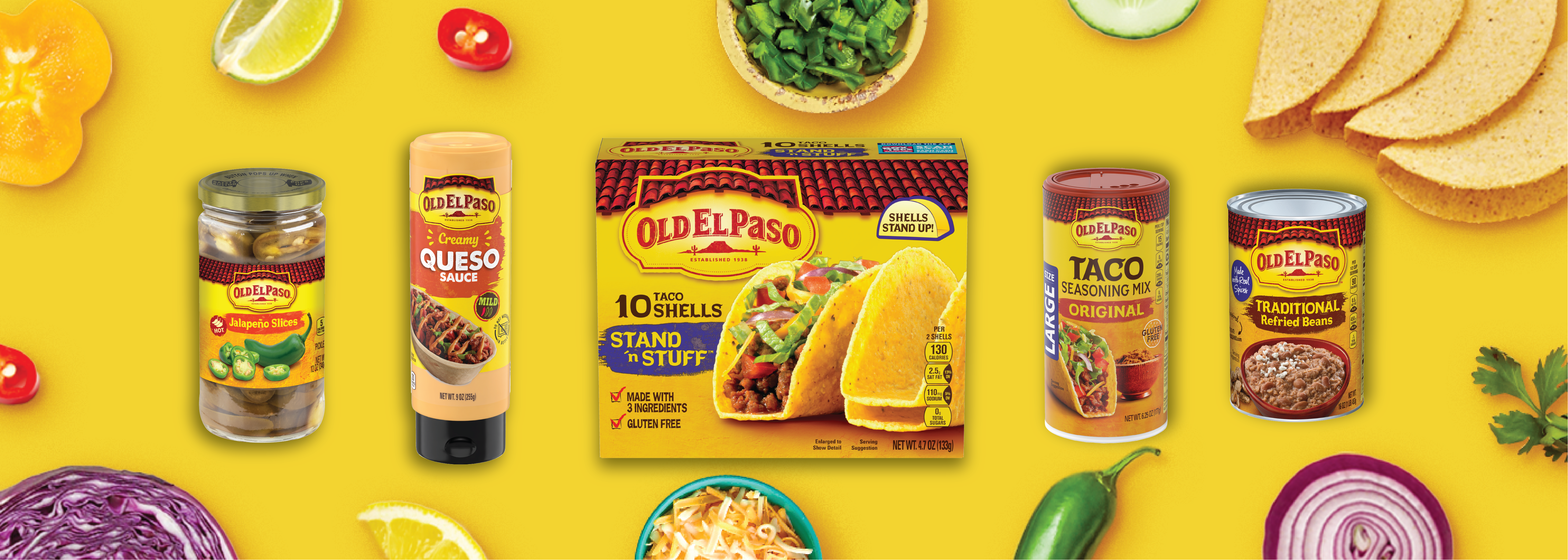 Old El Paso assorted products including Jalapeño slices, front of jar; Creamy Queso sauce, front of package; Stand n' Stuff taco shells, front of box; Original taco seasoning mix, front of package; and Traditional refried beans, front of can, on a yellow background surrounded by taco ingredients